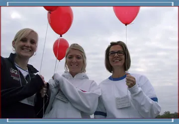 three women holding balloons at the Diabetes Walk