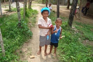 two young boys holding toothbrushes